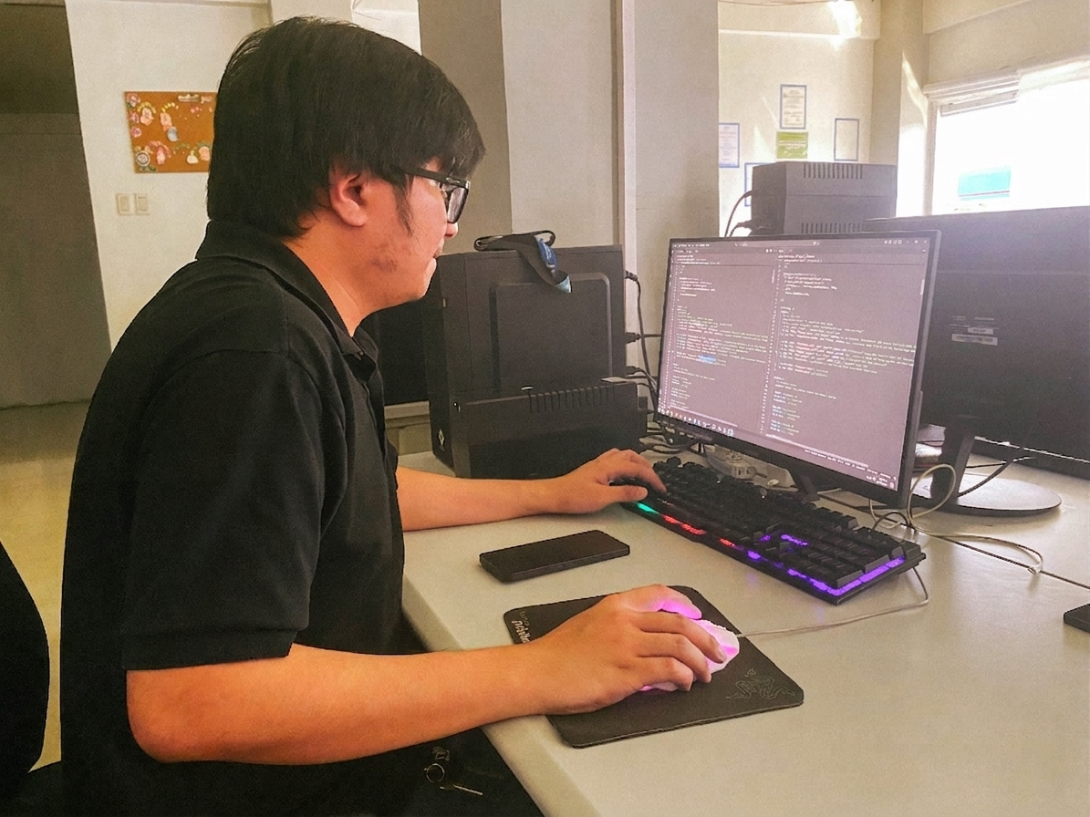 Office scene of a programmer working on coding tasks.